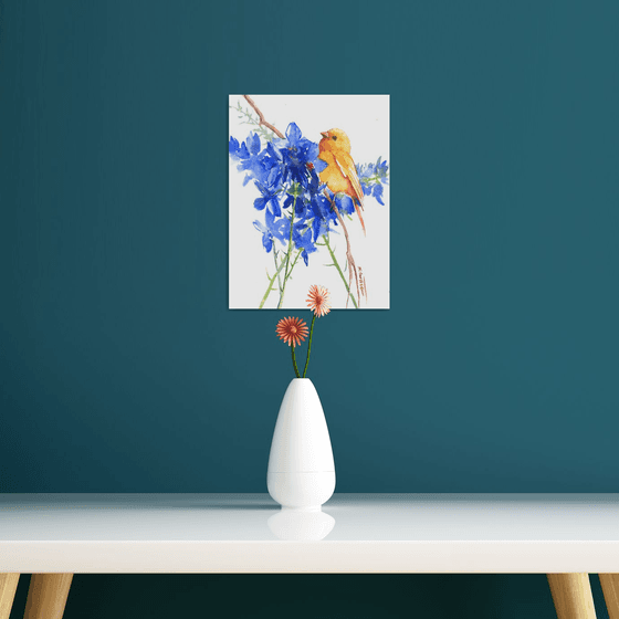 small canary and big blue flower