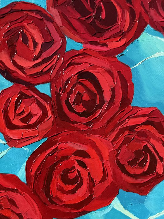 Crimson petals.Blue silence