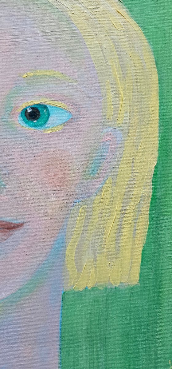 Young and blond soft green woman portrait