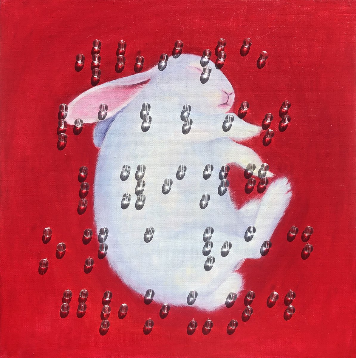 White rabbit lying on a red ground by Julia Kuzina
