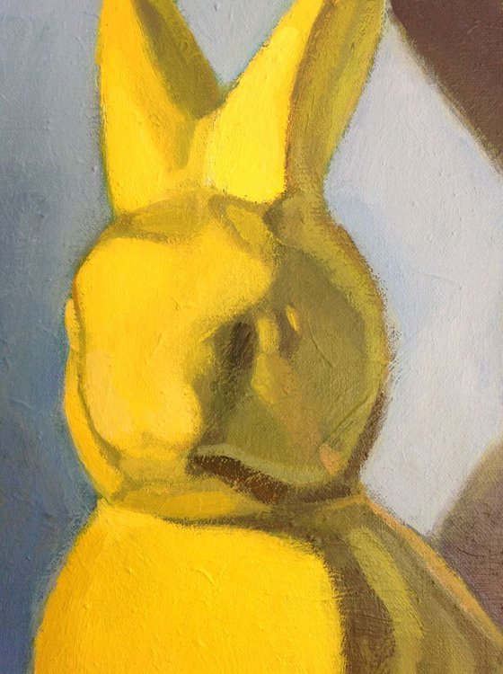Yellow rabbit on tin can