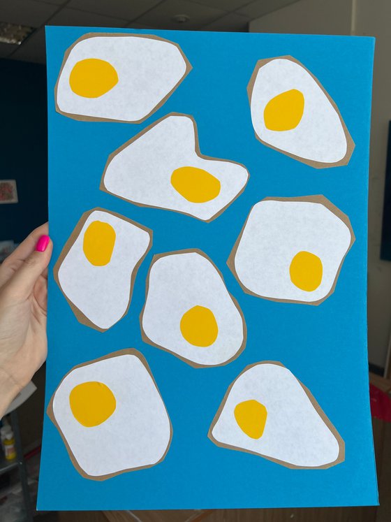 Fried Eggs on Blue Background