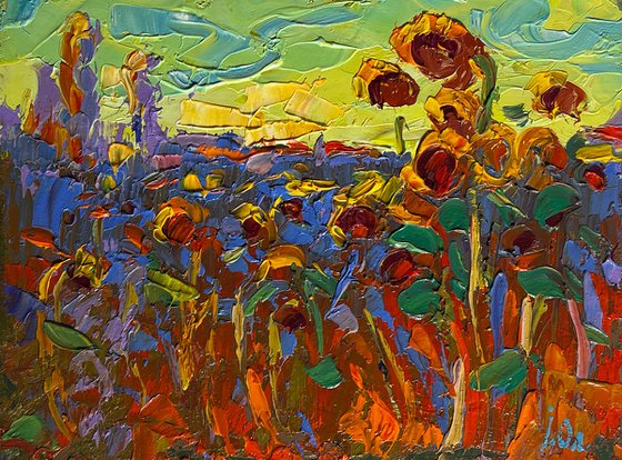 Yellow sunset over sunflowers