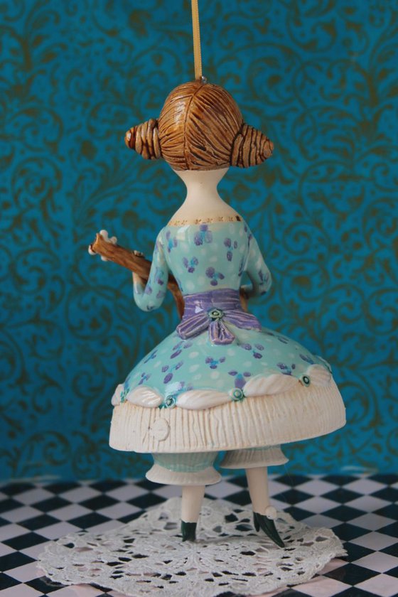 Girl with a mandoli. Ceramic hanging sculpture