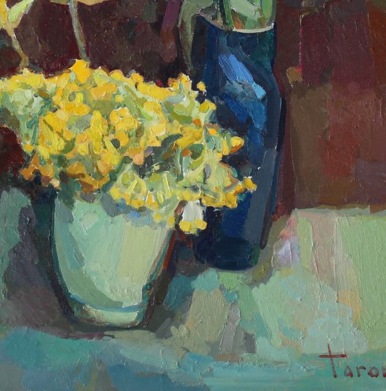 Yellow flowers with tulips