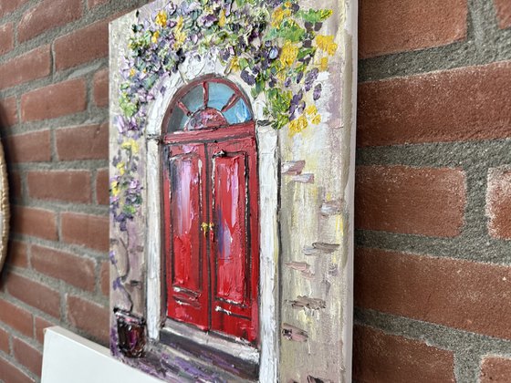 Red door with flowers