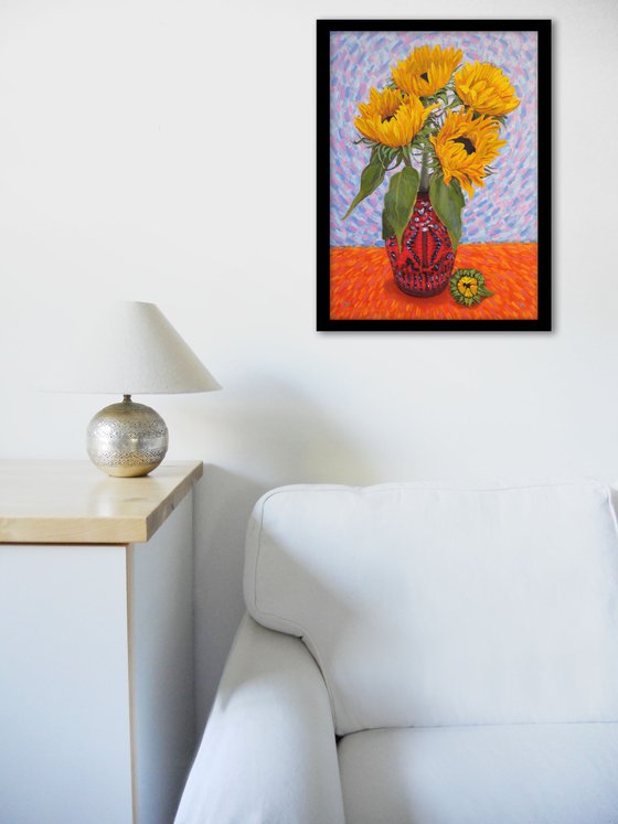 Four sunflowers in a vase