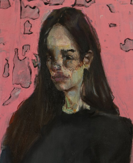 Portrait of a girl on pink