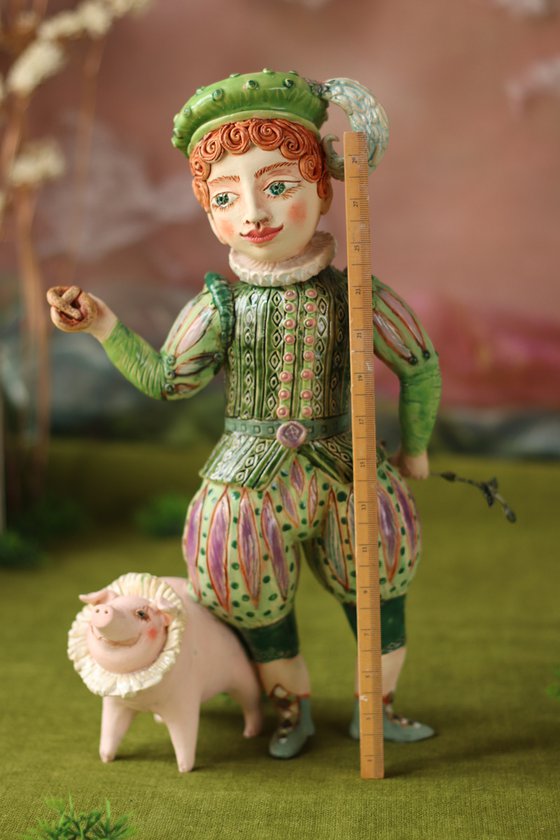 Boy with a pig hiding his rod behind.