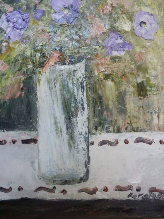 Petunias in a glass vase