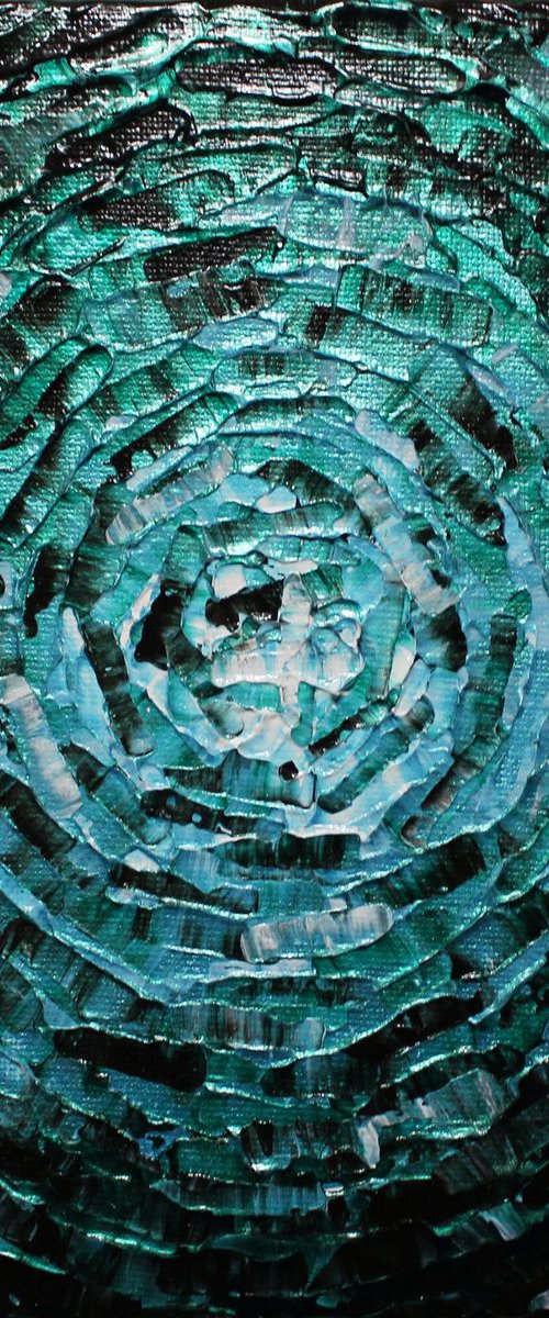 Small shine of iridescent emerald blue glow by Jonathan Pradillon