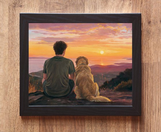 Boy sitting with a Golden Retriever dog