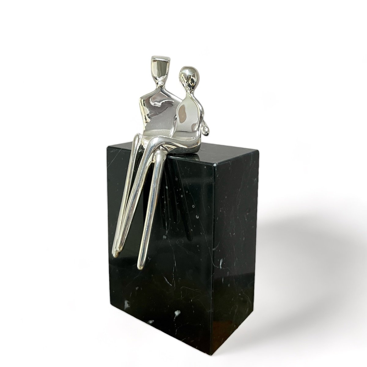 Caress a small silver plated sculpture of a loving couple by Yenny Cocq