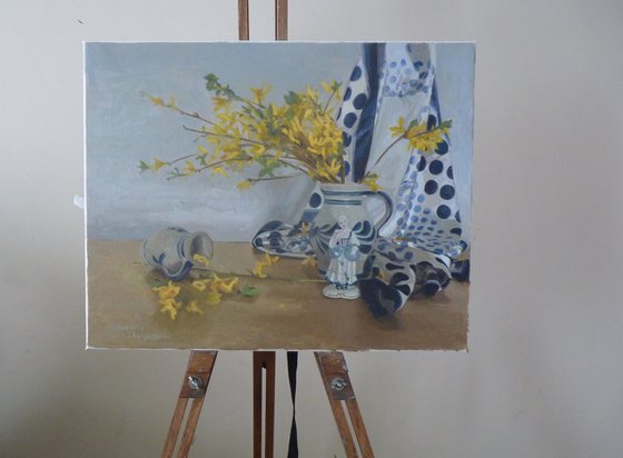 Yellow flowers and a statuette