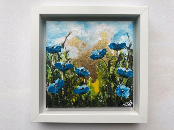 Blue poppies on gold leaf