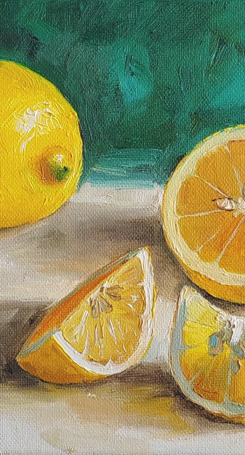 Lemon on emerald green background by Leyla Demir