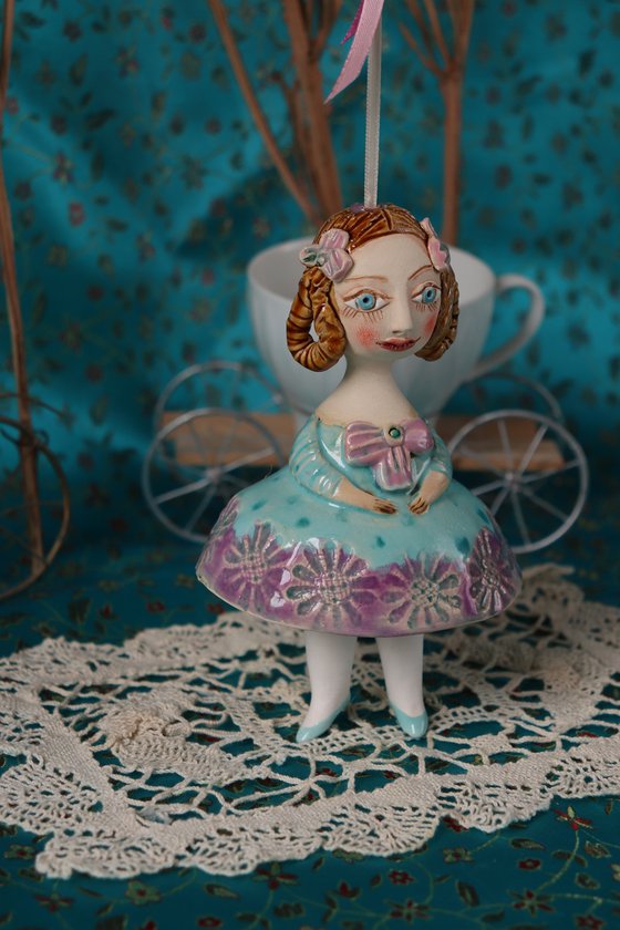 Little Girl in Mint Blue Dress. Tiny hanging sculpture