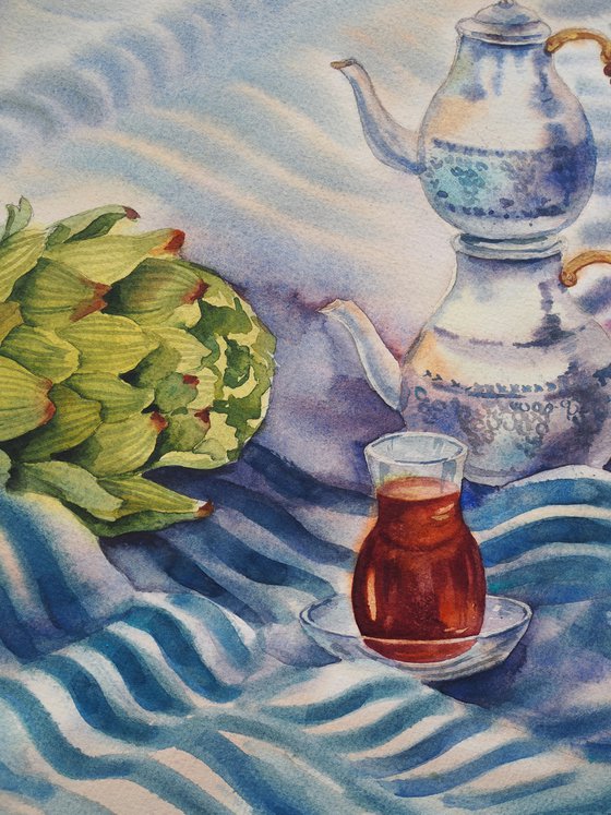 Turkish still life with tea and artichoke on a striped towel