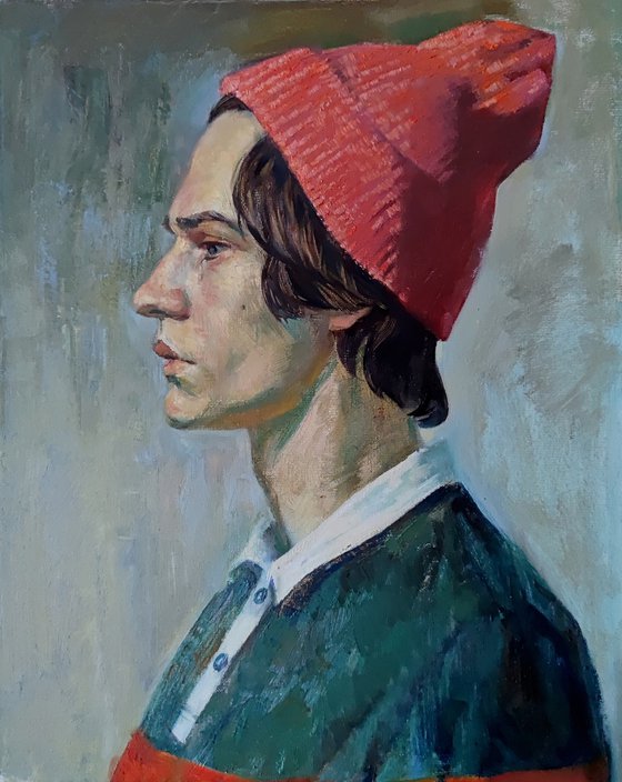 Young man in a pink hat
