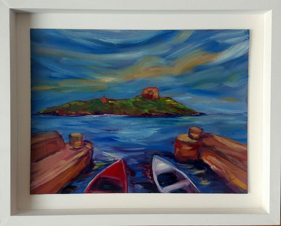 Blue skies over Dalkey Island with the boats of Coliemore Harbour