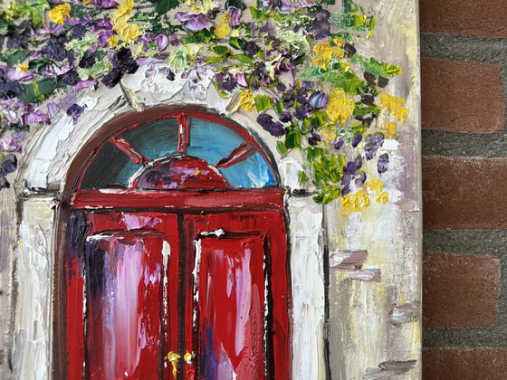 Red door with flowers