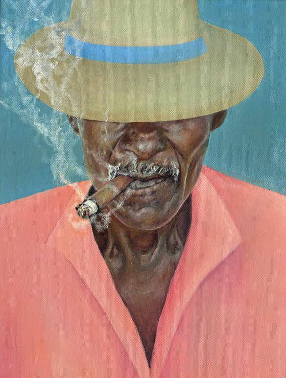 Smoking man in a hat