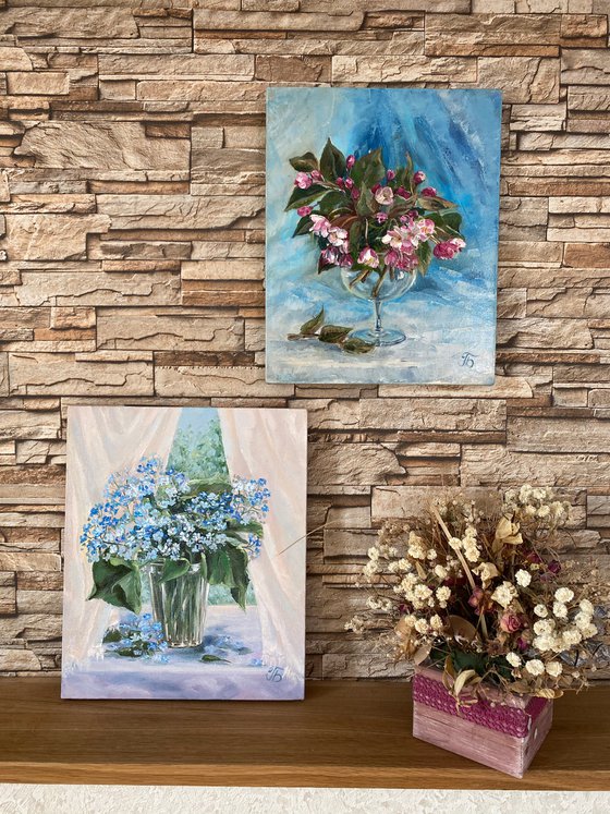 Spring mood. Bouquet in a glass on a blue background.