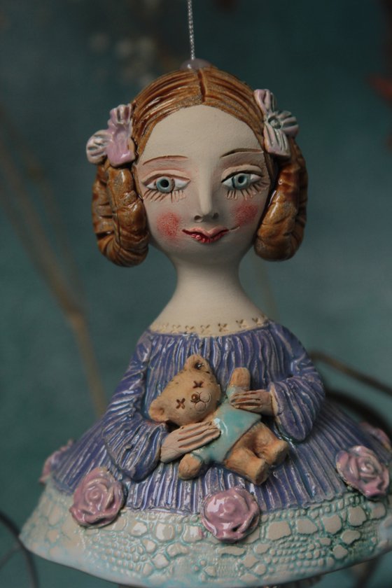 Little Girl in an blue dress with a teddy. Hanging sculpture, bell doll by Elya Yalonetski