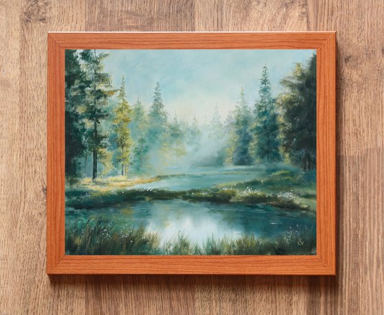 Misty lake in a pine forest