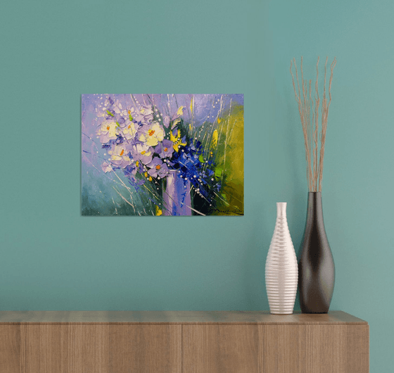 A bouquet of morning flowers in a glass