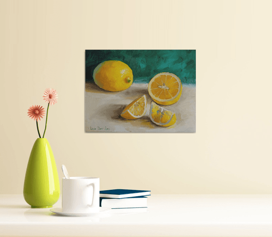 Lemon on emerald green background