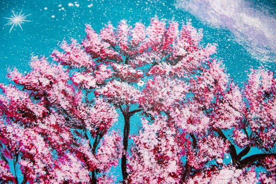 Pink sakura blossoms at night