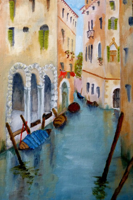 Boats moored in a Venetian Canal