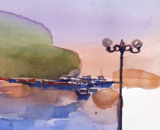 River flows, bench watches