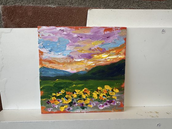 Orange sunset with flowers