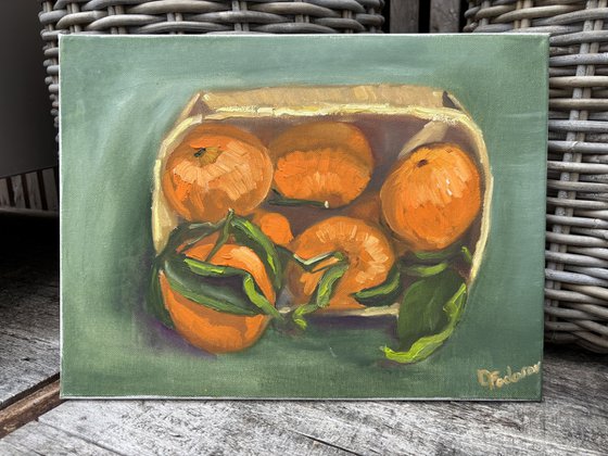 Tangerines in a wooden basket