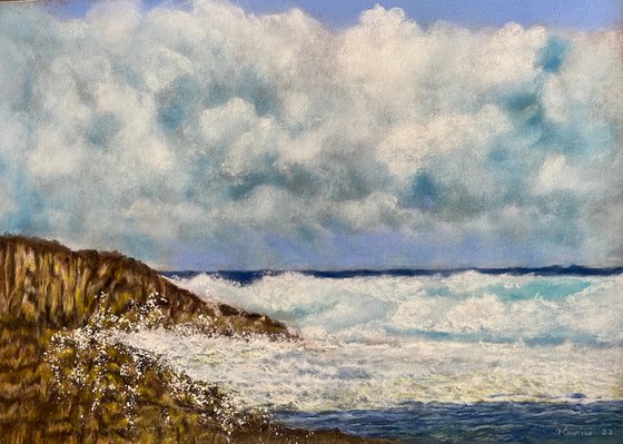 Cloudy skies and sea spray in pastels