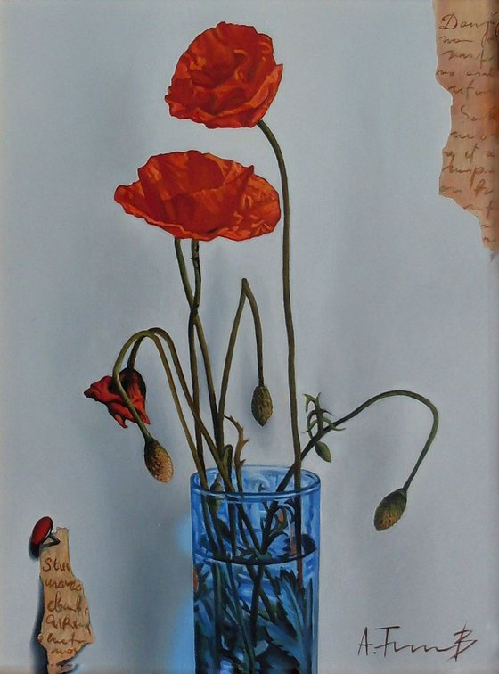 Poppies in a blue glass
