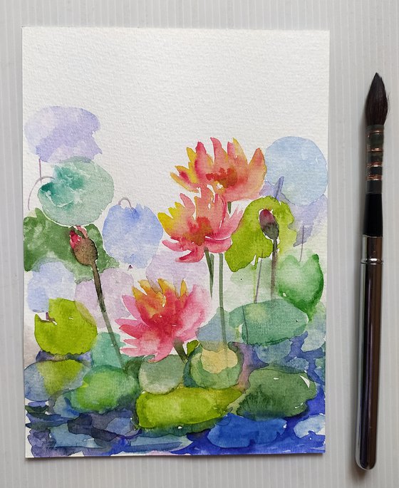 Three water lilies in a pond