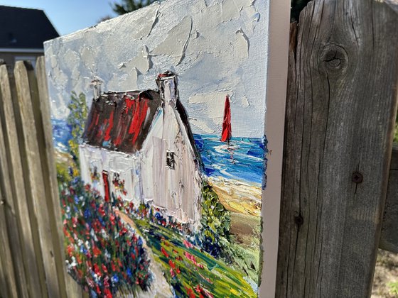 Old house with red flowers