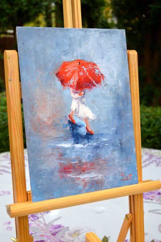 A girl running through puddles