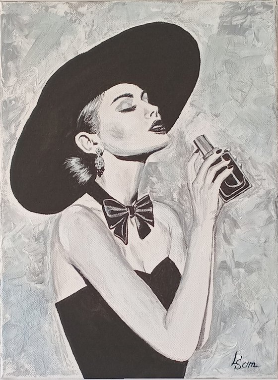 Woman with a bottle of perfume
