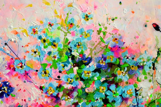 Forget me not flower field at sunrise