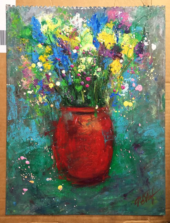 Red vase and meadow flowers