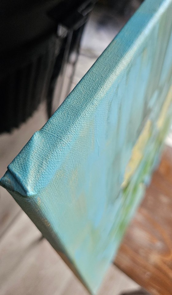 Yellow roses in a pot on blue