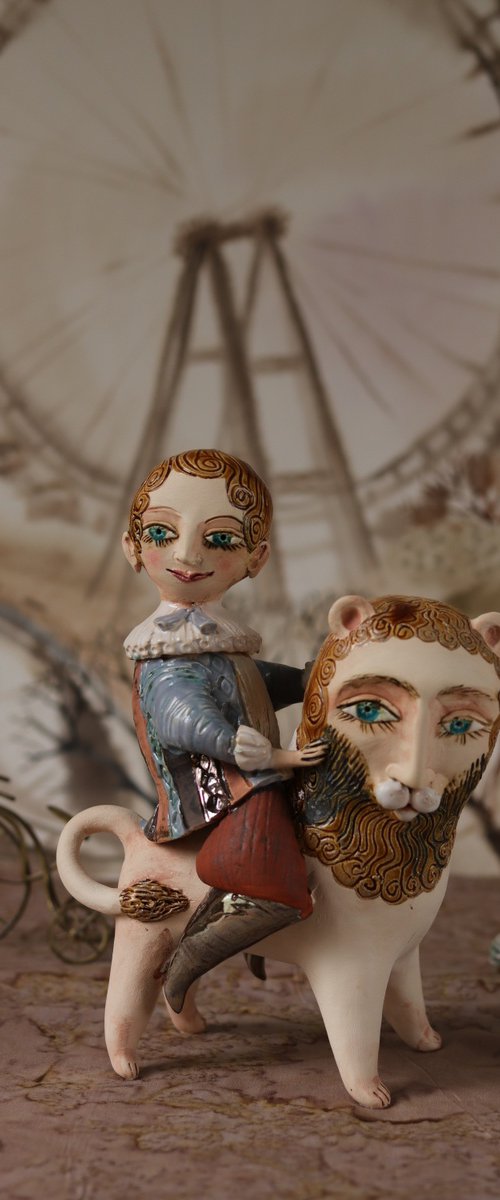 Vintage dressed boy riding a lion. From "Le Carousel, Hommage à l'Innocence" project by Elya Yalonetski by Elya Yalonetski