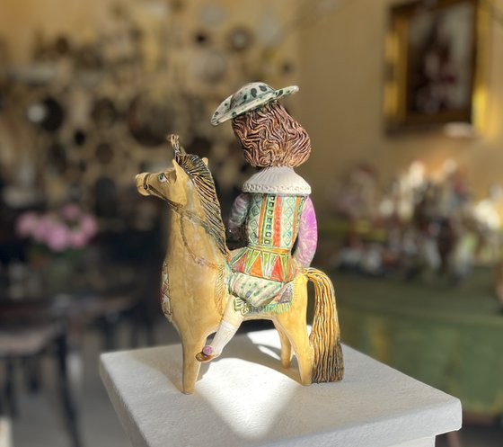 Vintage dressed girl with ice riding horse.