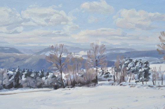 Path in the snow-capped Velay mountains