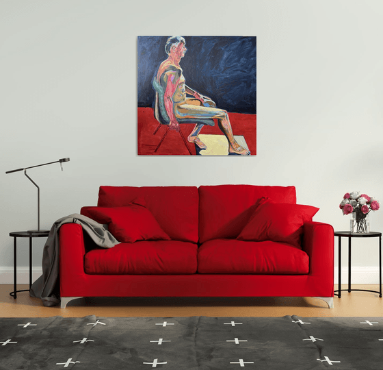Seated Chap in dark blue room