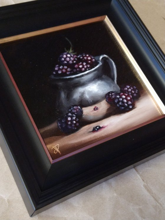 Silver cup with blackberries still life